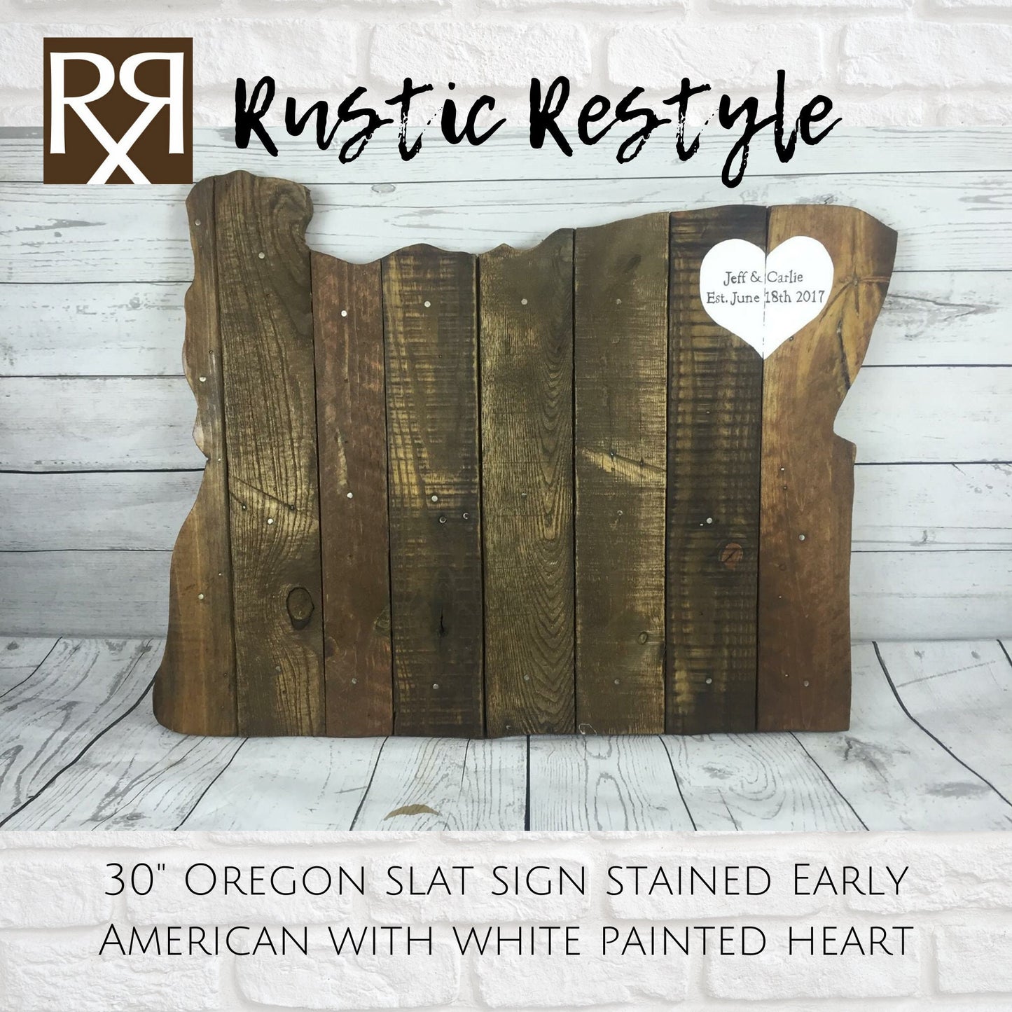 wood sign shaped like Oregon, old dark worn boards with nails sitting on a white washed wood background with a  White heart painted in the upper right with personalization Jeff & Carla