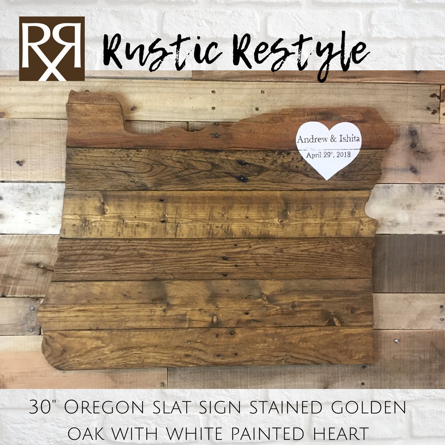 wood sign shaped like Oregon, old dark worn boards hanging on a rustic wood pallet wall with a  White heart painted in the upper right corner with personalization Andrew & Ishita