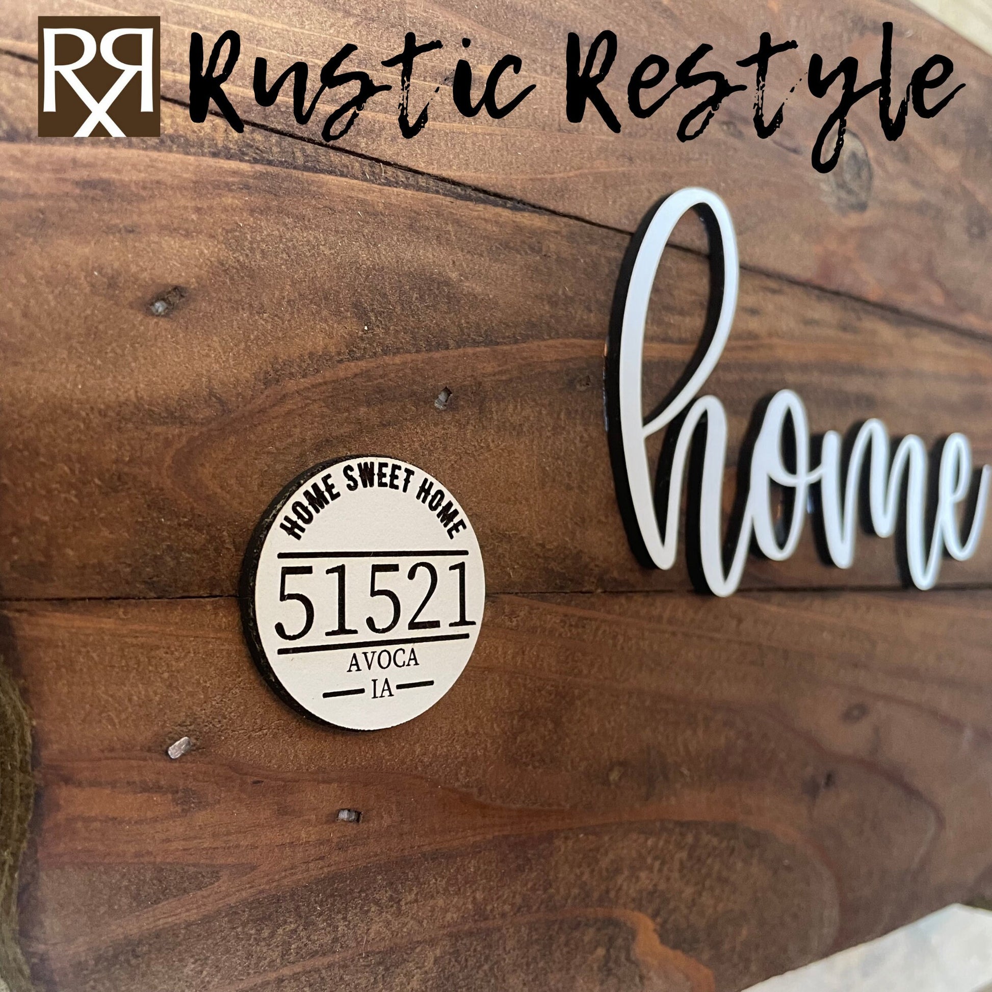 Close-up View Wooden Iowa shape sign, The word home is across the middle in white. There is a small white wooden disc on the left middle with home sweet home, 51521 zip code and Avoca engraved on it.
