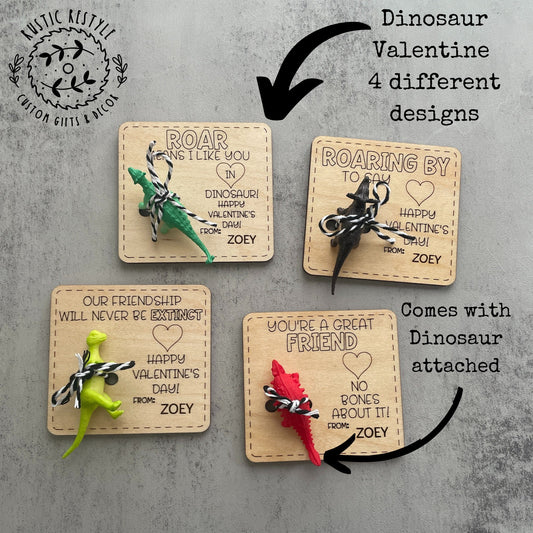 Set of four personalized wooden Valentine’s Day cards with attached mini dinosaur toys, featuring engraved stitched‑border designs and messages such as ‘Roar means I like you in dinosaur,’ ‘Roaring by to say Happy Valentine’s Day,’ ‘Our friendship will never be extinct,’ and ‘You’re a great friend, no bones about it