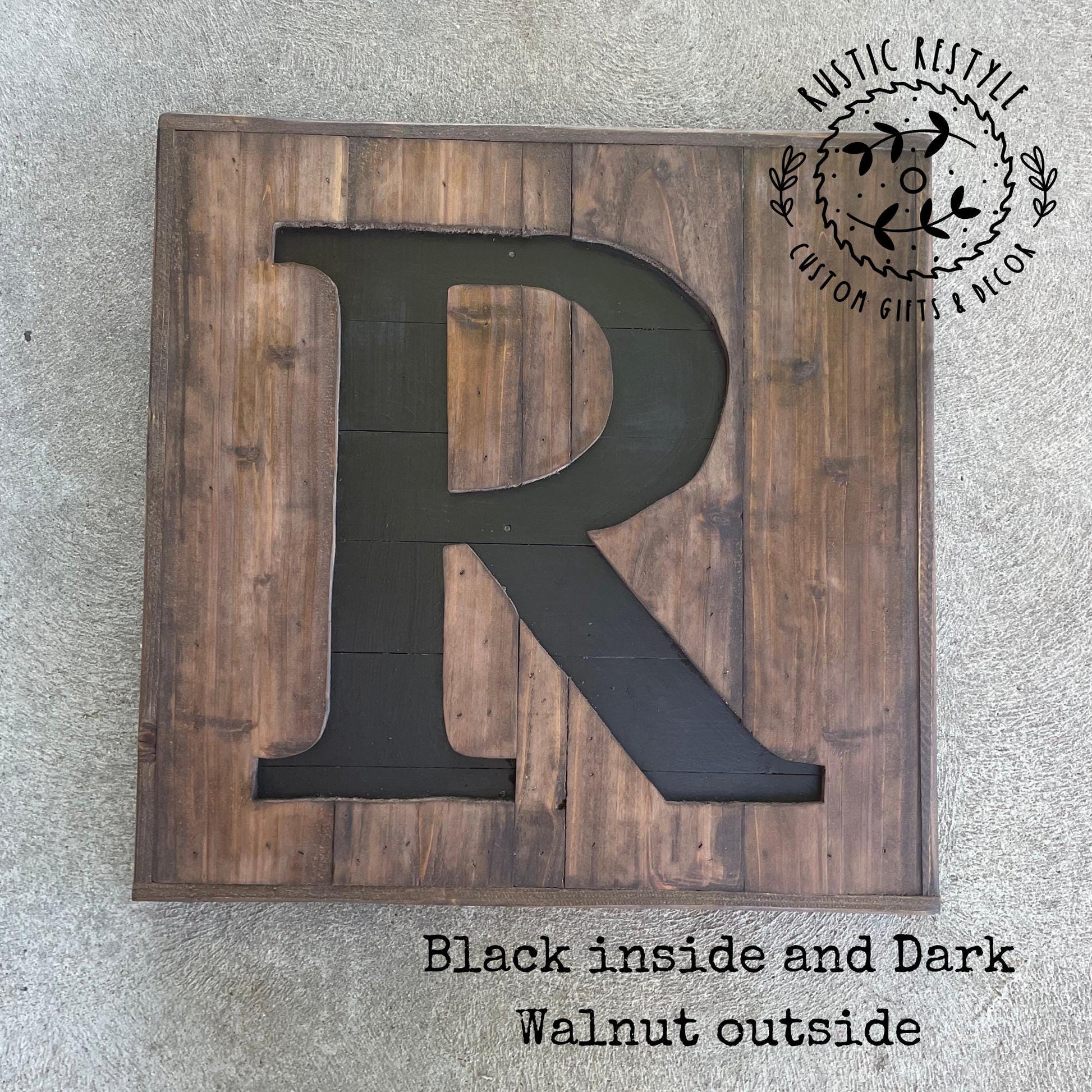 Layered wooden letter sign made from reclaimed wood, stained in two colors with a protective polyacrylic finish.