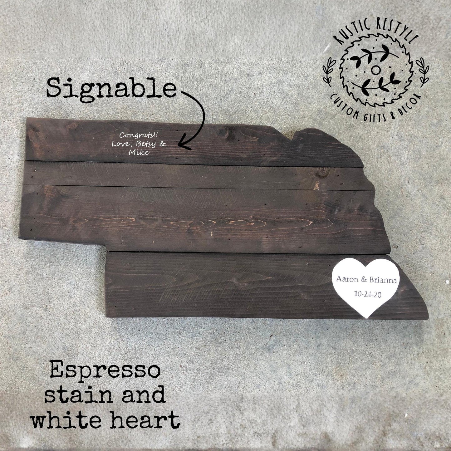 Rustic wooden Nebraska state cutout sign made from reclaimed wood, hand‑painted and distressed for use as wall décor or a wedding guest book alternative.