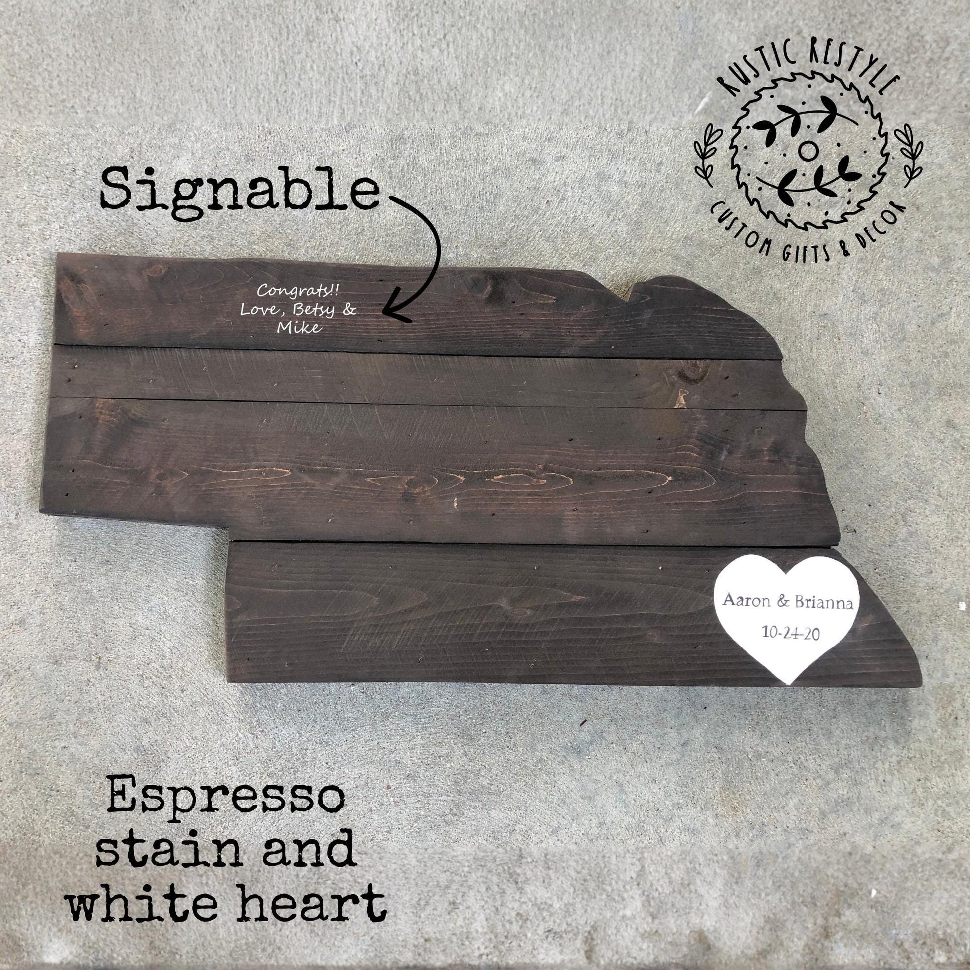 Rustic wooden Nebraska state cutout sign made from reclaimed wood, hand‑painted and distressed for use as wall décor or a wedding guest book alternative.