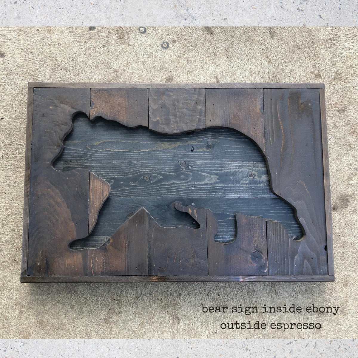 a wooden bear cut out, with the text "bear sign inside ebery outside espresso" written below it.