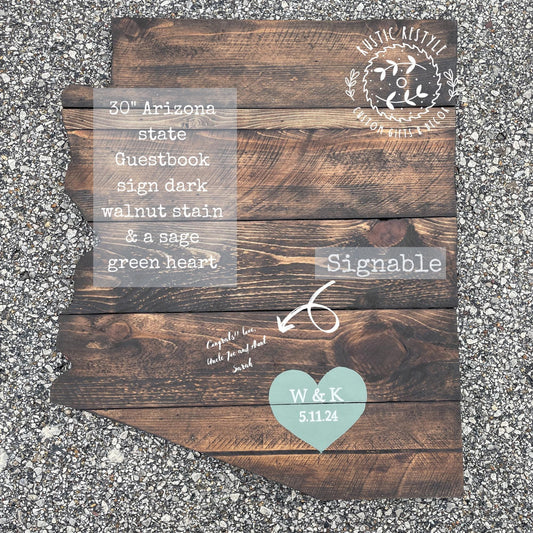 The image is a wooden sign depicting the state of Arizona, with a heart symbol and text indicating it is a guestbook sign.