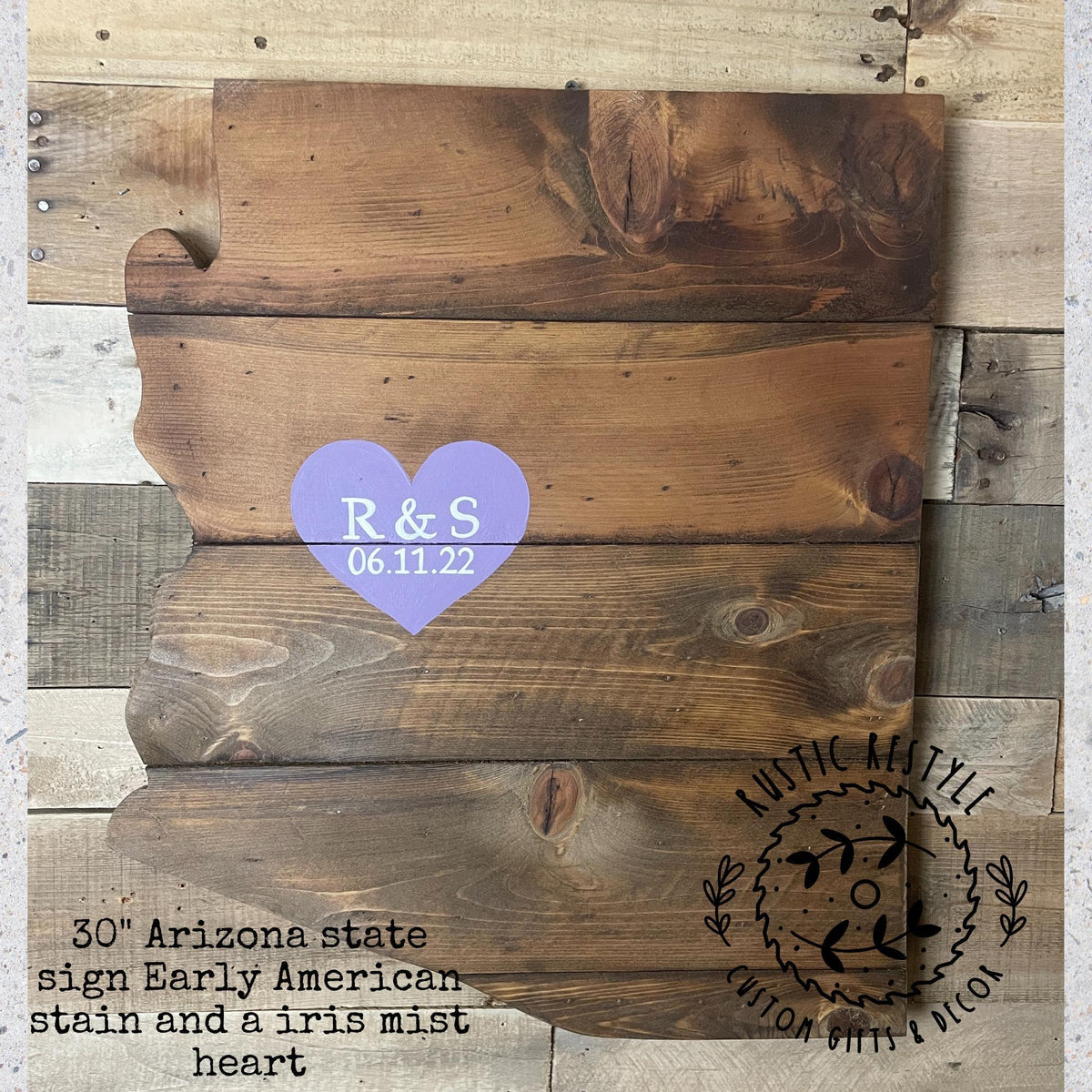 The image is a wooden sign depicting the state of Arizona, with a heart-shaped sticker in the center displaying the names 'R&S' and the date '06.11.22'.