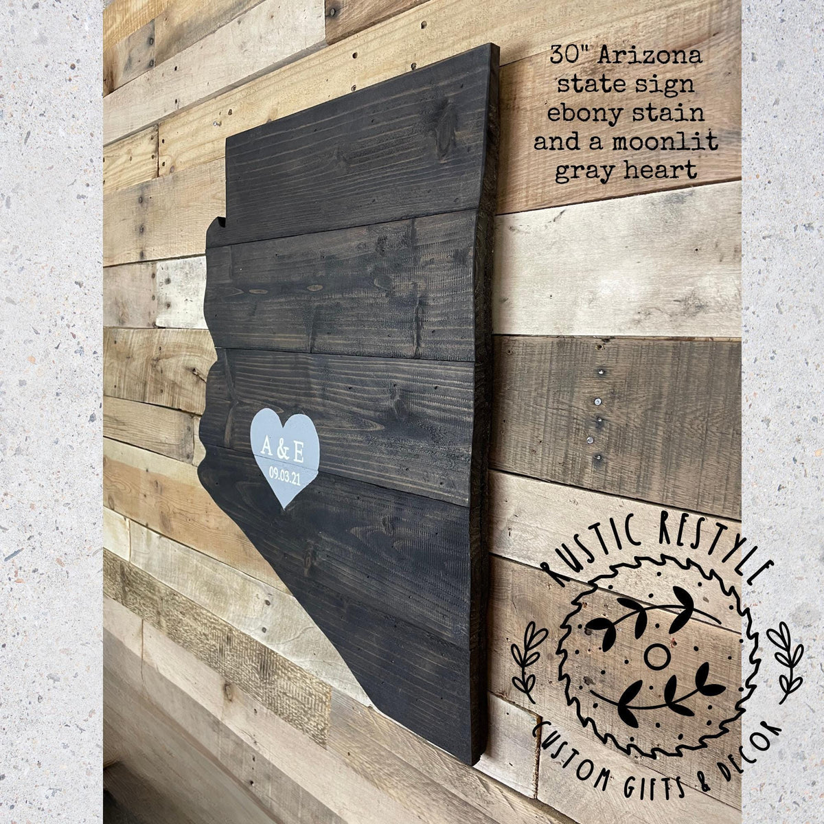 a wooden sign with a heart shape and the initials "A&E" on it, mounted on a wooden wall.