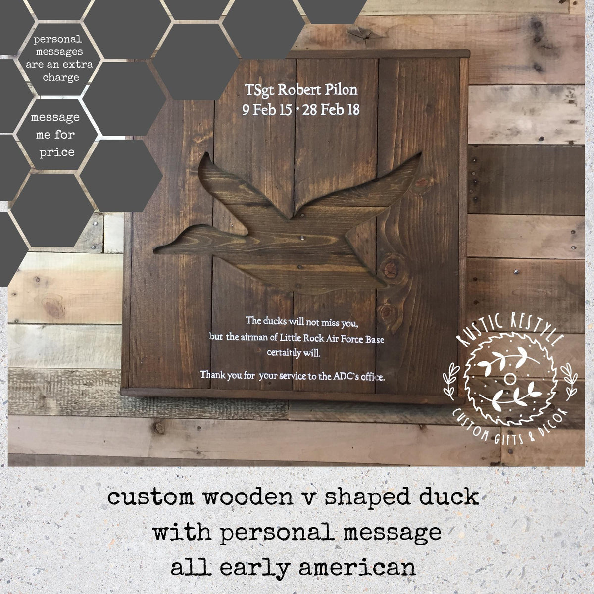 a wooden v-shaped duck with a personal message painted on to it, mounted on a wooden wall.